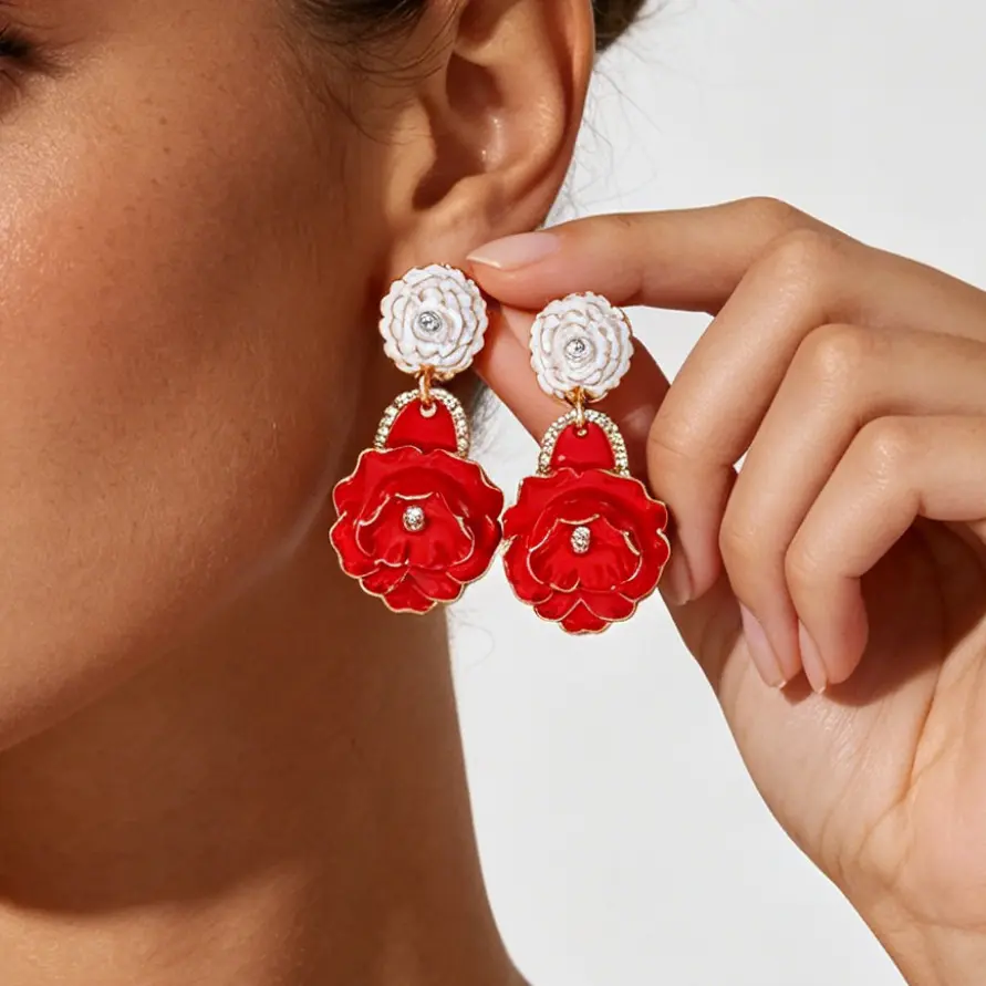 Material Performance: Solid zinc alloy flower frame, glossy uniform drip enamel coating, clear sparkling rhinestones, sturdy bend-resistant iron ear pins Structure Design: Double-layer vertical drop structure, small top flower + rhinestone link + large three-dimensional rose pendant Enamel Craft: Smooth full-color glaze filling, distinct petal contour golden metal edging, long-lasting bright color without fading Silhouette Advantage: Oversized vertical layered floral shape, visually lengthen neck lines and brighten facial makeup Wearing Comfort: Well-balanced lightweight integrated molding, no heavy dragging pressure on earlobes for all-day wear Color Selection: Five high-saturation dopamine bright tones to match all summer holiday and casual wardrobes Craftsmanship: Secure welded connecting links, firmly set rhinestones, seamless polished metal edges without burrs Wearing Structure: Dangle drop stud earrings, simple to put on and take off for daily & party styling Styling Positioning: Luxury ZA-style dopamine multi-layer enamel flower statement earrings, multi-scene beach commute party fashion ear jewelry Applicable Matching: Linen resort dresses, bikini cover-ups, silk camisoles, vintage blouses and romantic date outfits