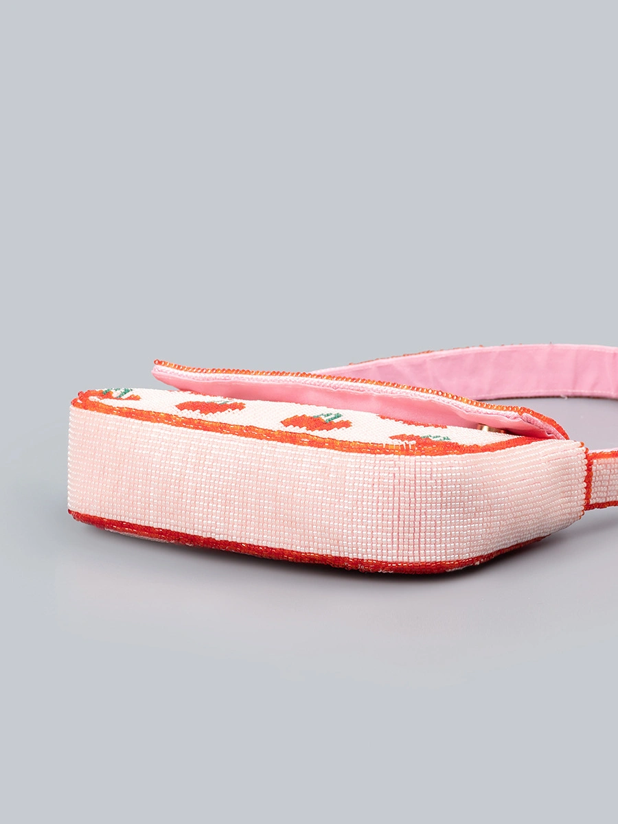 Material Performance: Double polyester fabric for exterior and lining, wear-resistant and lightweight, tightly woven rice beads with firm stitching, not easy to fall off Structure Design: Mini horizontal square bag body, single full beaded matching shoulder strap, hidden built-in magnetic buckle closure Bead Craft: Dense uniform rice bead embroidery, clear heart and cherry fruit printing patterns, smooth neat bead surface without burrs Silhouette Advantage: Medium-firm fabric keeps the bag upright and three-dimensional, will not deform or collapse after long-term storage Storage Capacity: Compact 21514cm size, enough to hold mobile phone, lipstick, keys, bank cards and other daily small belongings Color Selection: Six different bead pattern color styles for mixed wholesale matching Craftsmanship: Integrated seamless stitching on bag edges, reinforced connection between shoulder strap and bag body, durable for daily frequent use Wearing Structure: Single underarm shoulder strap design, lightweight and no shoulder pressure for all-day carrying Styling Positioning: Fresh sweet heart cherry rice bead embroidery mini underarm bag, multi-scene daily summer women shoulder handbag Applicable Matching: Casual sundresses, camisoles, jeans, knit tops and other daily casual summer outfits